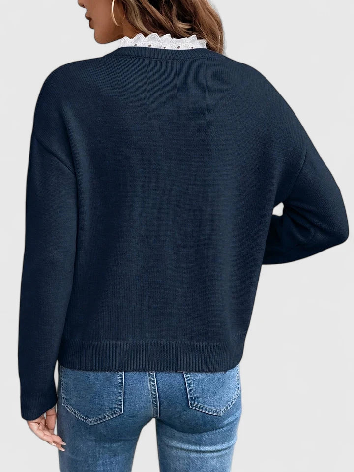 KLARA – V-HALS TRUI MET KANTDETAIL